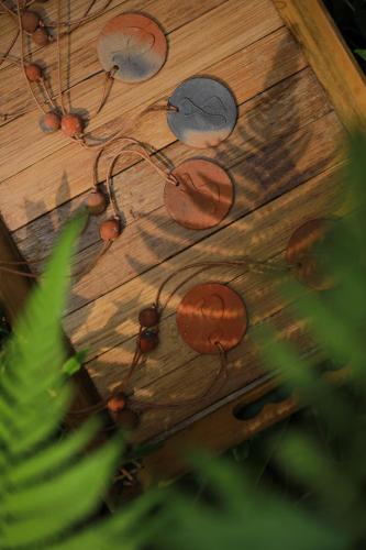 a wooden table with many knobs on it at Wayanad Wild - A CGH Earth Experience in Vythiri