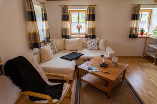 a living room with a couch and a table at Apartment Haider 2 in Obertraun