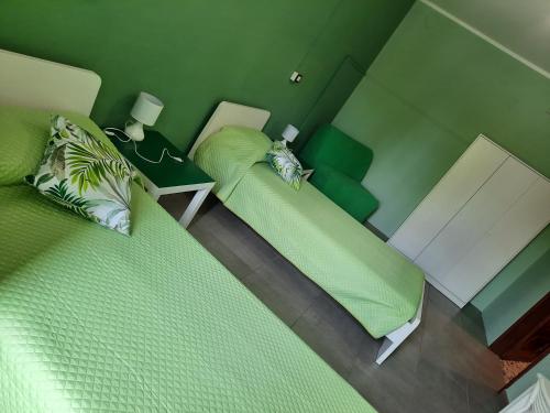 En eller flere senge i et værelse på Locanda della luna rossa