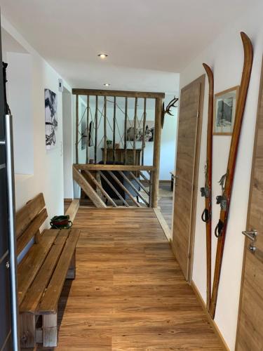 a hallway with wooden floors and a wooden door at Appartements Wolfgang Auderer in Jerzens