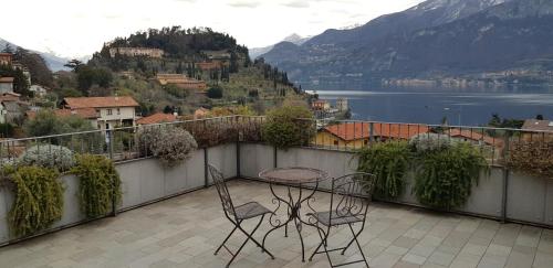 a patio with a table and chairs on a balcony at Bellagio Holiday Home in Bellagio