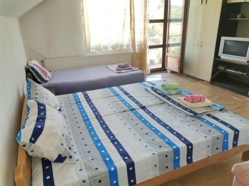 Una cama o camas en una habitación de Smeštaj Urošević