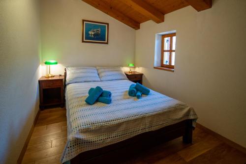Villa Flaveico tesisinde bir odada yatak veya yataklar