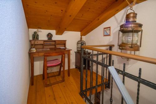 a stairway with a desk and a lamp at Villa Flaveico in Pašman