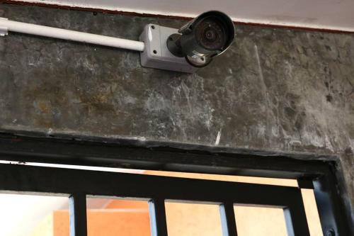 a security camera on the side of a door at 2 Home in Chalong 