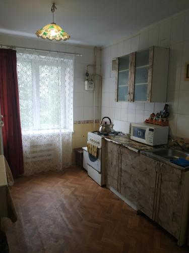 Kitchen o kitchenette sa Квартиры