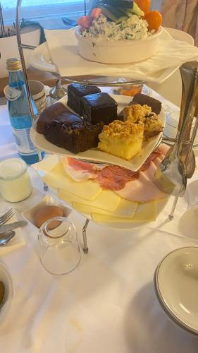 a table with two plates of different types of food at Villa Vera in Ora/Auer