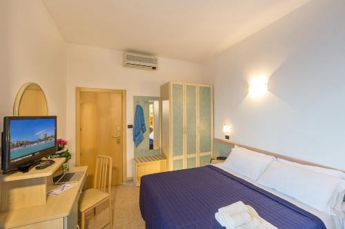 Postel nebo postele na pokoji v ubytování Hotel Excelsior