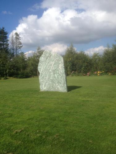a sculpture in a field of green grass at Give Bed & Breakfast in Give