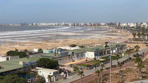 an aerial view of a beach with buildings and the ocean at PRESTIGIA ESSAOUIRA MOGADOR Luxury Ocean View in Essaouira