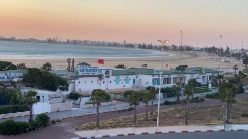 a view of a beach with houses and the ocean at PRESTIGIA ESSAOUIRA MOGADOR Luxury Ocean View in Essaouira