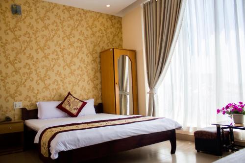 Katil atau katil-katil dalam bilik di Thanh Long Da Lat Hotel