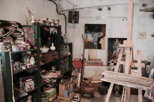 a room with a lot of items on shelves at El Carmen in Ribera Alta