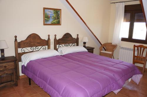 En eller flere senge i et værelse på APARTAMENTOS LAS ERAS