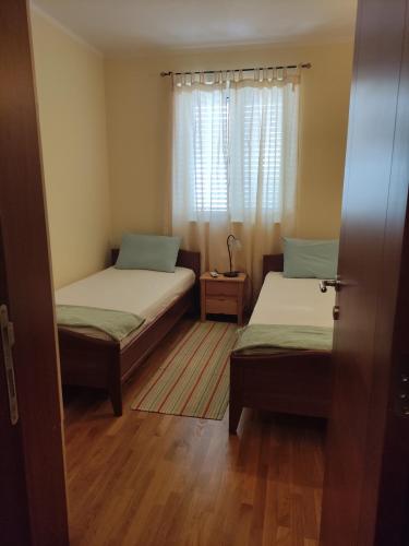 A bed or beds in a room at Apartment Golubović