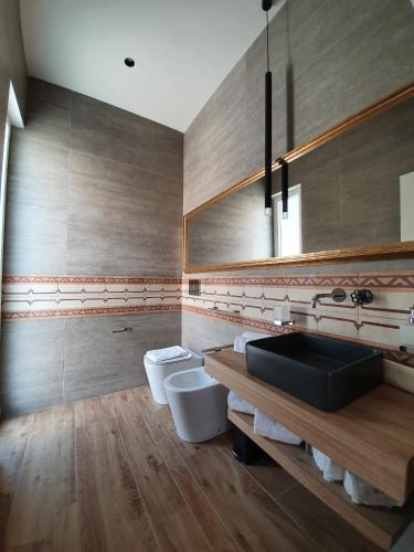 a bathroom with two toilets and a sink at MY HOUSE LUXURY HOME in Marsala