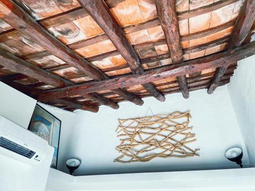 a chandelier hanging from a ceiling in a room at Casita Beatriz - by Casa del Patio in Estepona