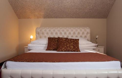 Posteľ alebo postele v izbe v ubytovaní Penzión Hučava