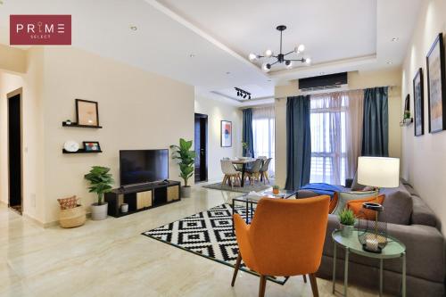 a living room with a couch and a table at Prime Select Point 90 Mall in Cairo
