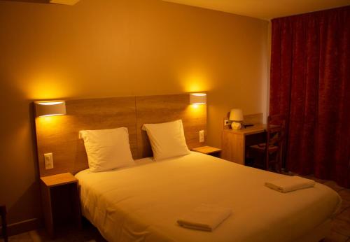 Säng eller sängar i ett rum på Hotel Marinet
