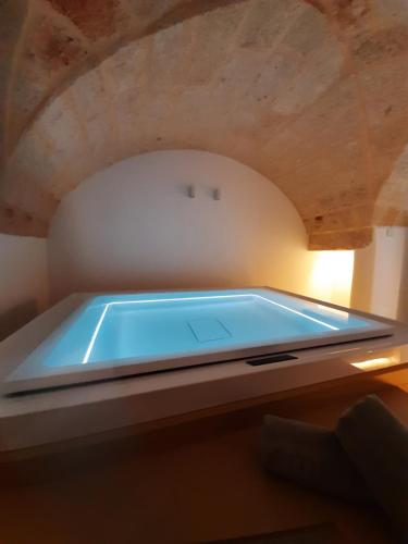 a swimming pool in a room with a ceiling at Christian's Suites & Spa in Fasano