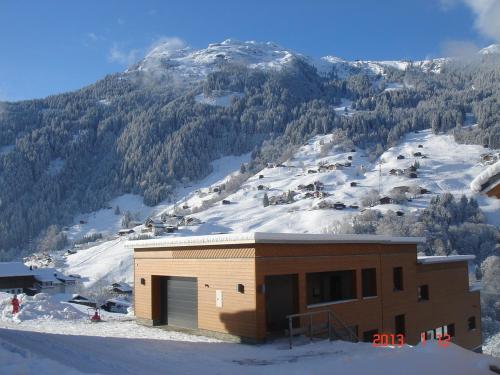 a building on top of a snow covered mountain at Haus Elisabeth in Gaschurn