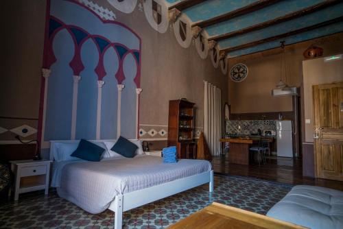 En eller flere senge i et værelse på DOMUS AMABILIS - ESPAI GAETA