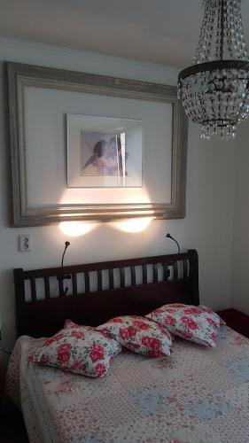 a bedroom with a bed with two pillows on it at Het Vakwerkhuis in Valkenburg