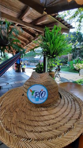 a straw hat sitting on top of a table at Sendero del Rio Finca Hotel in San Rafael