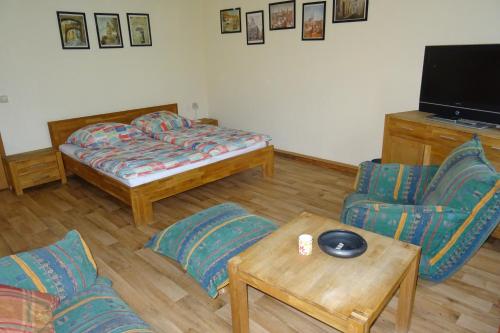 Ένα ή περισσότερα κρεβάτια σε δωμάτιο στο Müllers zweite Ferienwohnung in der Altstadt von Görlitz