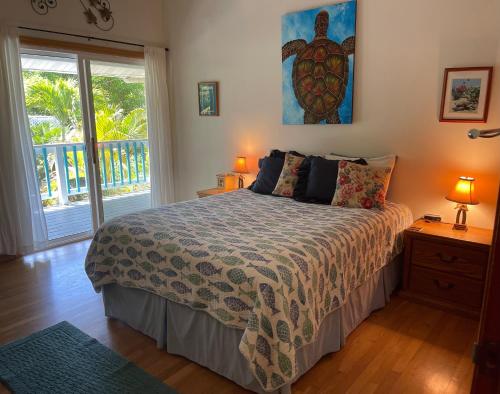 a bedroom with a bed and a window at Ala Kai Bed and Breakfast in Keaau