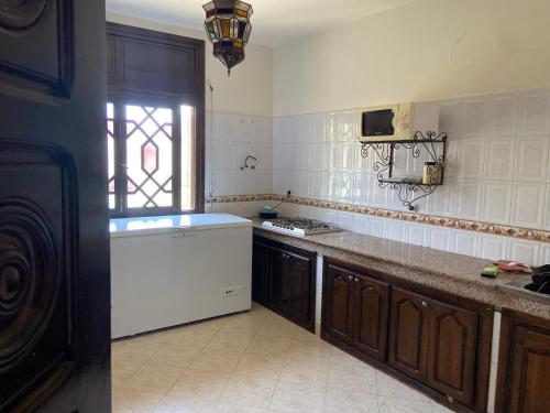 a kitchen with a sink and a counter top at Appartement lumineux in Marrakesh