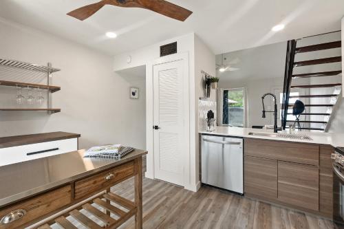 a kitchen with white walls and a ceiling at Contemporary Couples Getaway Near Austin Favorites - Loft 21 in Austin
