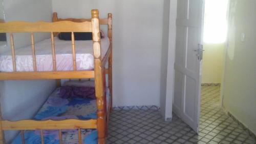 a bedroom with two bunk beds in a room at Hostel da Paz in Maceió