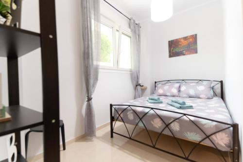 Postel nebo postele na pokoji v ubytování Kristi Central Home Ioannina