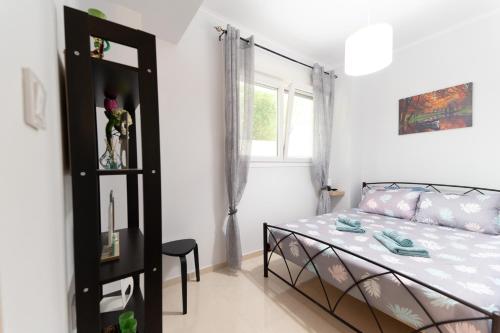 Postel nebo postele na pokoji v ubytování Kristi Central Home Ioannina