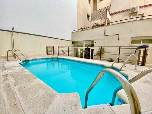 a swimming pool at a hotel at Charming Ópera in Madrid