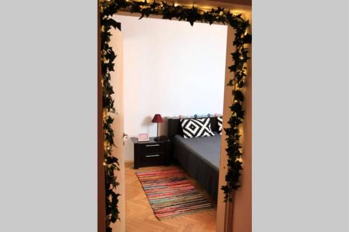 a bedroom with a mirror with a bed in it at Rox Central Apartments 5 in Timişoara