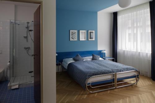 Кровать или кровати в номере AXA Hotel