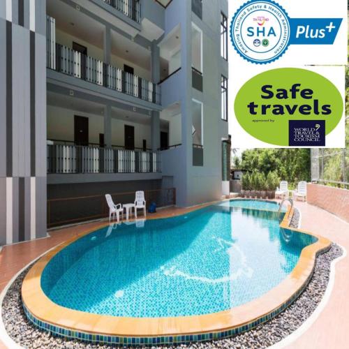 a villa with a swimming pool at a hotel at Phranang Place- SHA Extra in Ao Nang Beach