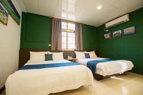 Cama o camas de una habitación en 阿鑫民宿