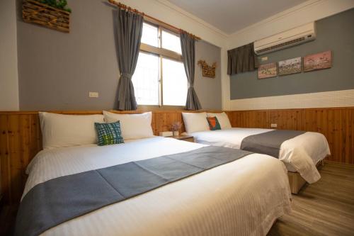 Cama o camas de una habitación en 阿鑫民宿