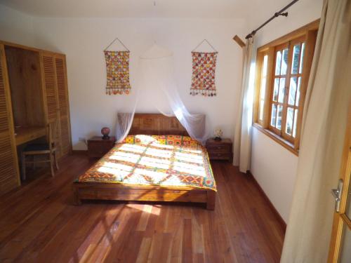 Кровать или кровати в номере LÌlot Beach Chalets