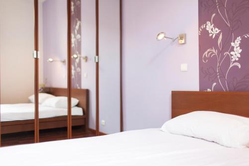 Posteľ alebo postele v izbe v ubytovaní DaVinci Radziwiłłowska Apartments