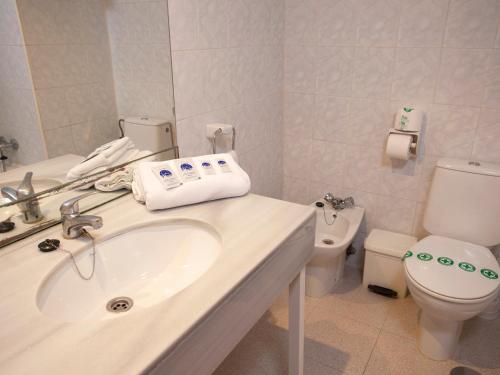 a bathroom with a sink and a toilet at Magic Villa de Benidorm in Benidorm
