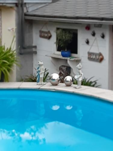 a swimming pool in front of a house at Haus Steffi in Müllheim