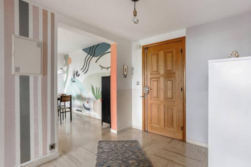 a hallway with a door and a dining room at Sea view apartment in residence with swimming pool! in Nice