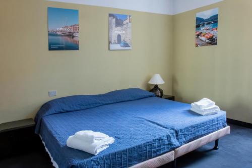 Ένα ή περισσότερα κρεβάτια σε δωμάτιο στο Hotel Britannia