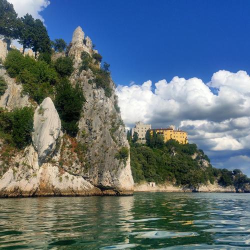 a view of a mountain from the water at Residence Ruje in Prepotto