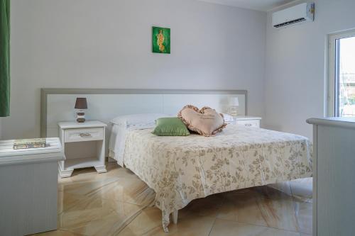 Posteľ alebo postele v izbe v ubytovaní Stabiaeflor Apartment